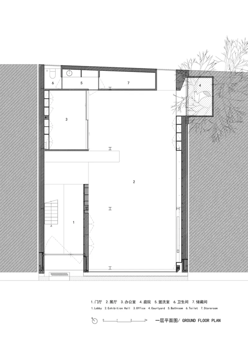 Ground floor plan drawing showing lobby, exhibition hall, office spaces and exterior courtyard with trees