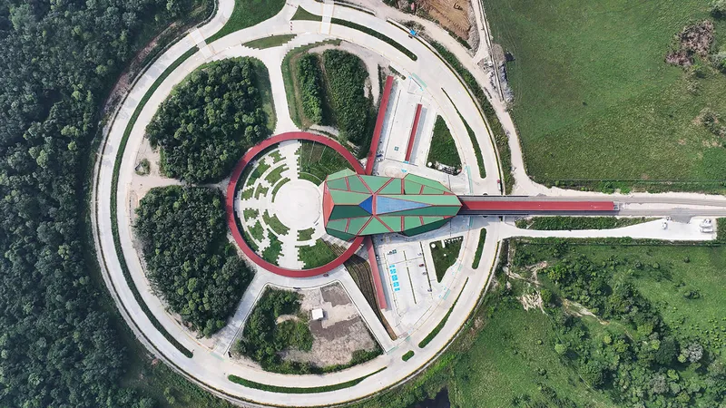 Top-down view of the radial site plan with circular access roads and landscaped islands