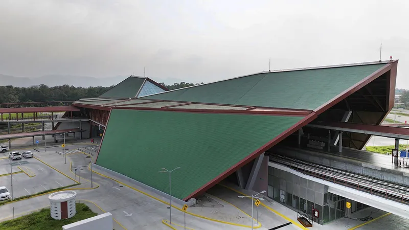 Angled view of the folded green roof planes above the station platform and drop-off area