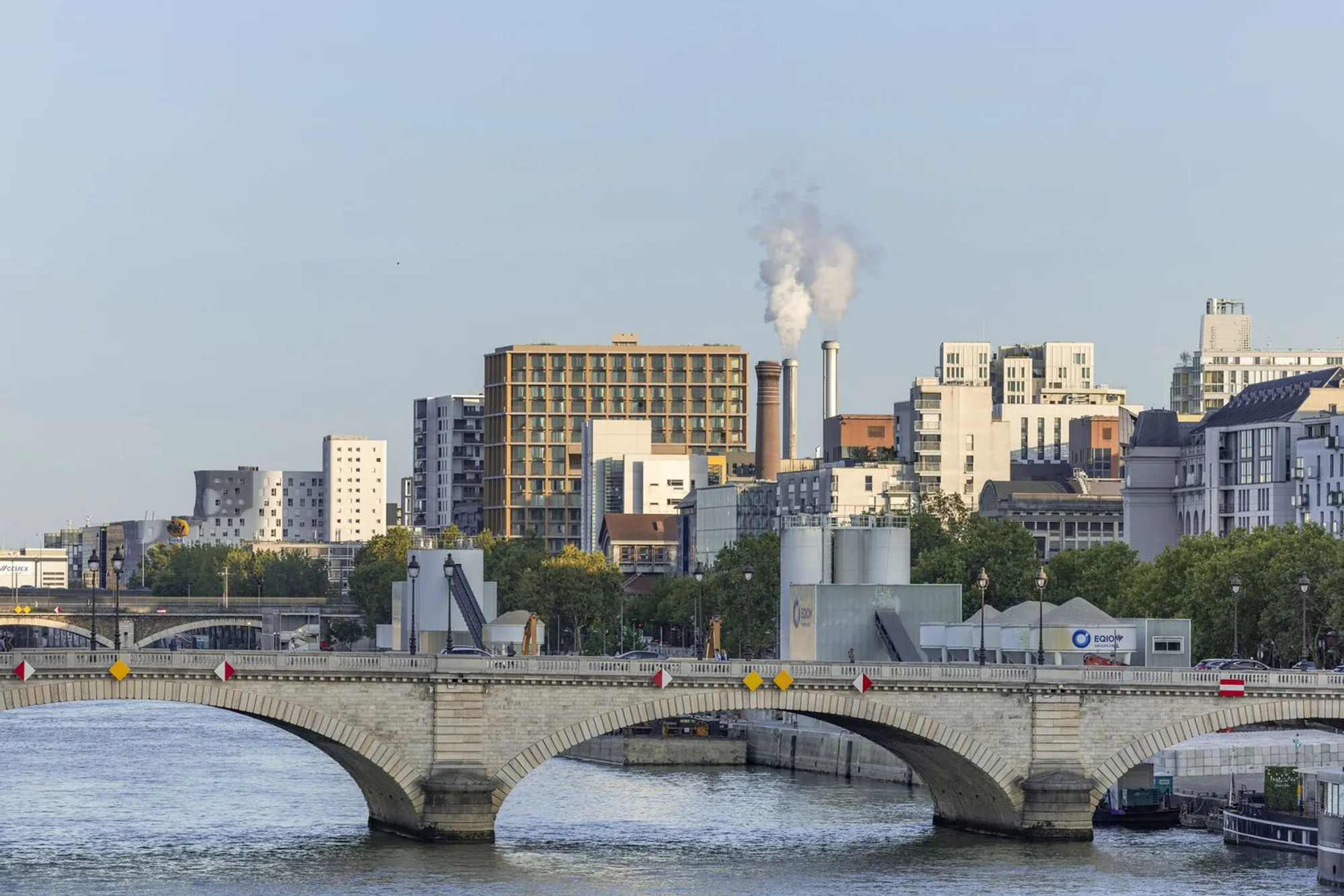 LAN Architecture Wraps a 50-Meter Timber Tower in Glass on the Banks of the Seine