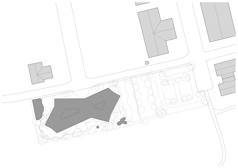 Site plan drawing showing building footprint among neighboring structures and planted landscape with trees