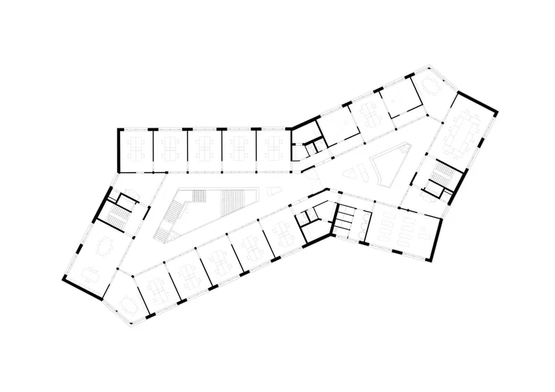 Floor plan drawing showing upper level with stairs and diagonal circulation spine connecting three wings