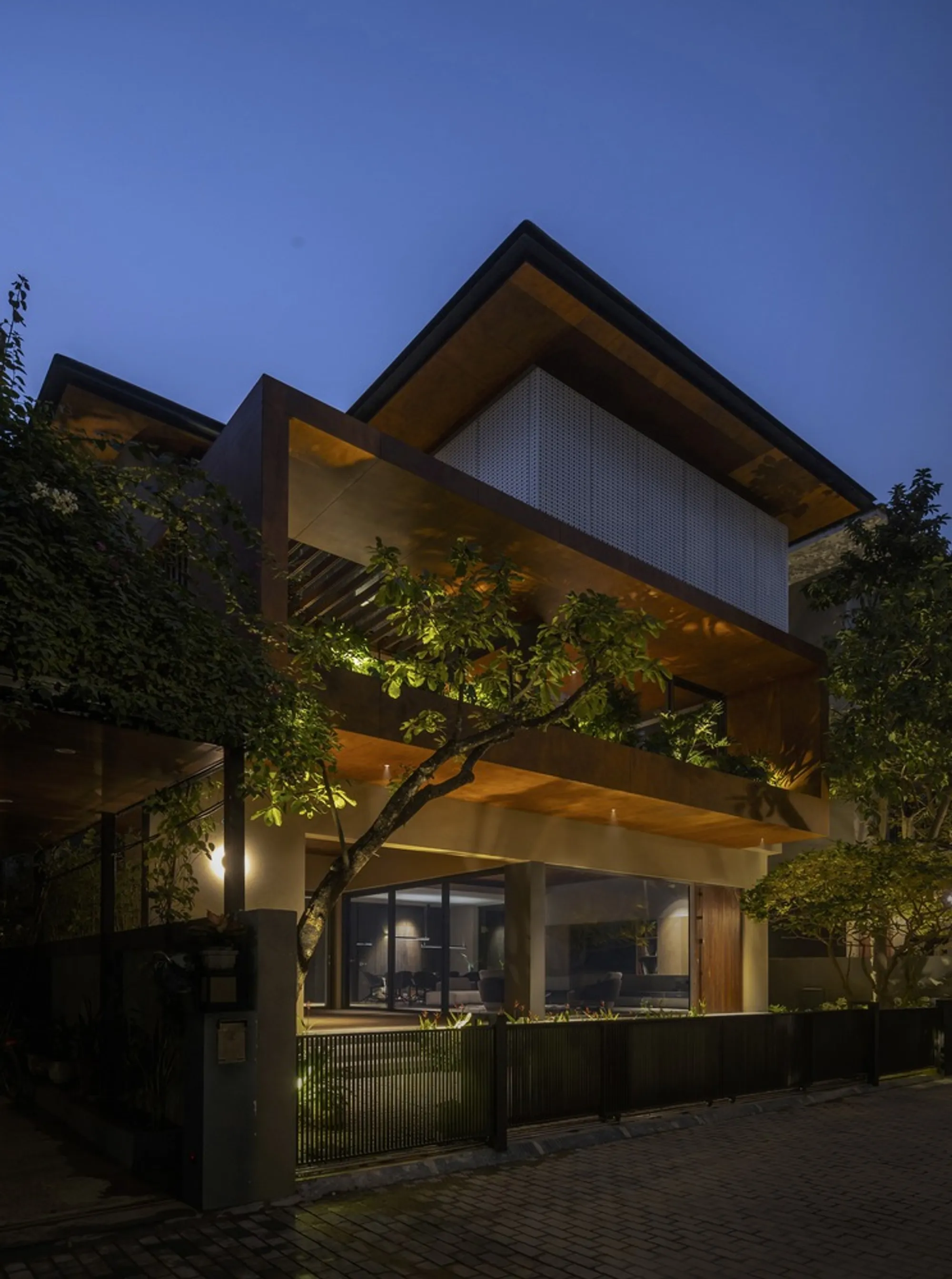 APDI Weaves Courtyards Through a Three-Level Hanoi Villa to Cool It from the Inside Out