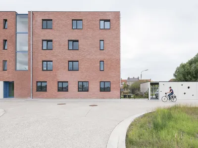 POLYGOON Architectuur Stacks 22 Social Housing Units to Liberate a Public Square in Diksmuide