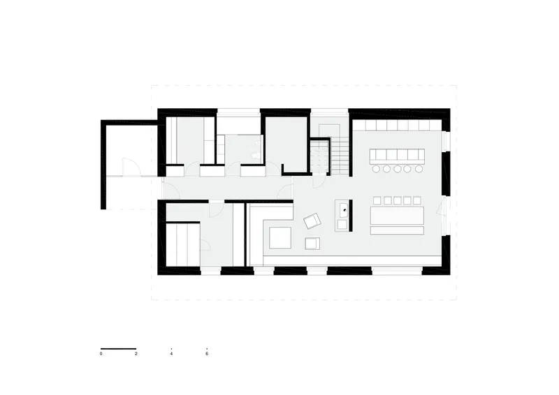Floor plan drawing showing living and dining areas with bedrooms arranged along one side