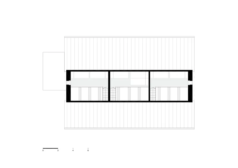 Section drawing showing the upper floor with three staircases and rooms beneath a pitched roof