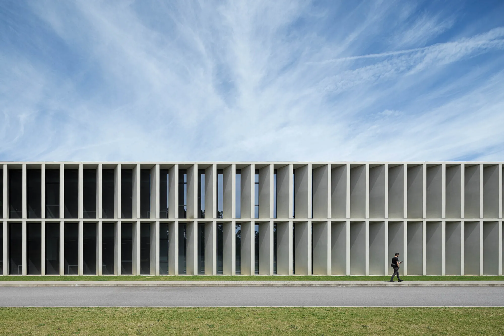 Multiprojectus Wraps a Portuguese Factory in a Relentless Rhythm of Concrete Fins
