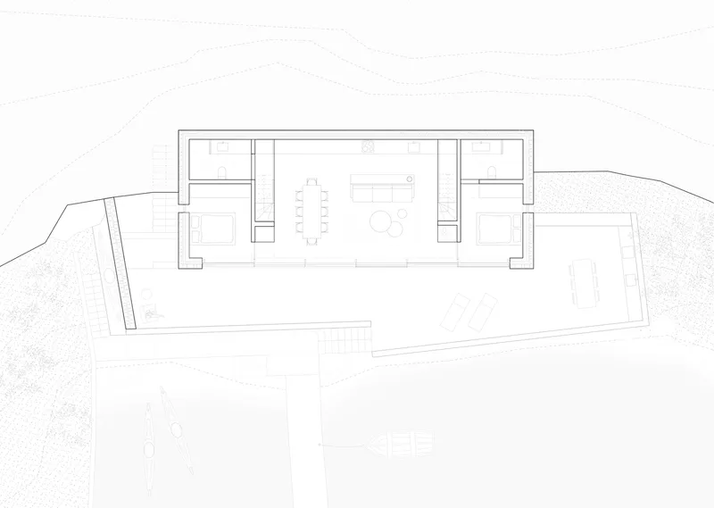 Floor plan drawing showing linear arrangement of rooms with central dining and living space