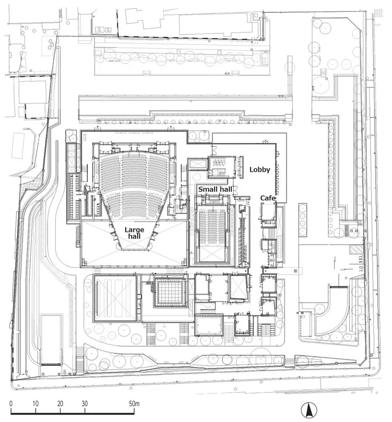 Site plan drawing showing a large hall with fan-shaped seating alongside smaller halls and cafe spaces