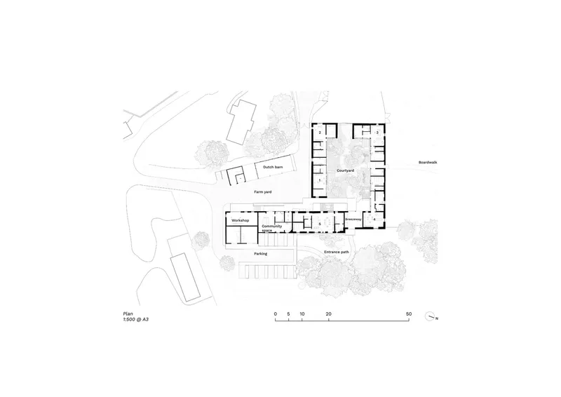 Site plan drawing showing barn conversion with courtyard and two outbuildings among existing trees