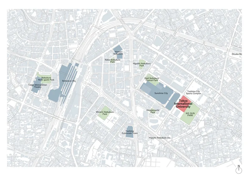 Site plan drawing showing the campus location highlighted in red among surrounding urban blocks and parks