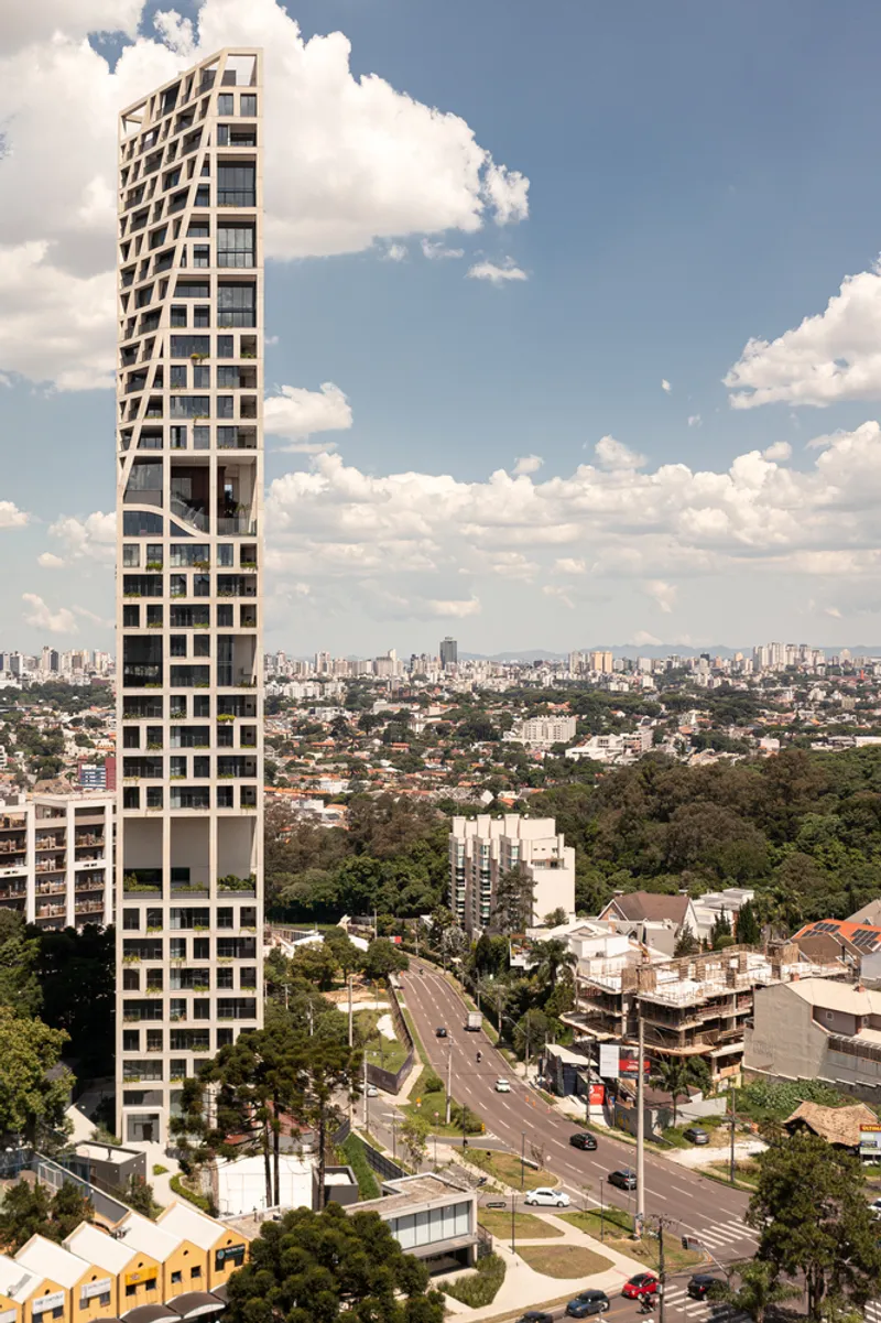 Side elevation showing the rotating floor plates creating a spiraling tower form above the street