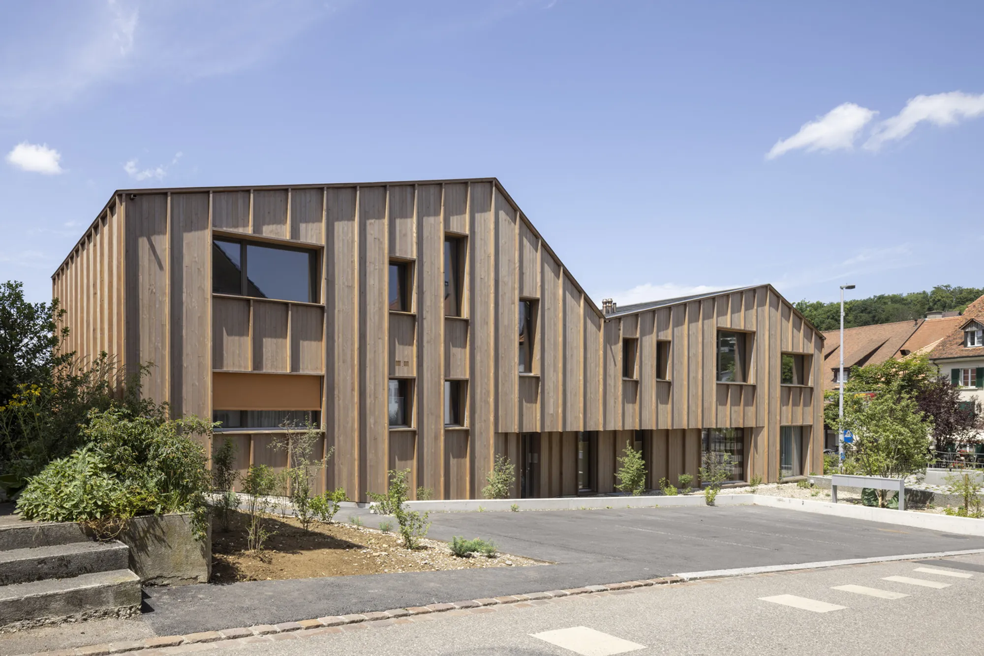 Beck Oser Architekten Replaces an Old Carpentry Workshop with Timber Housing in Elgg