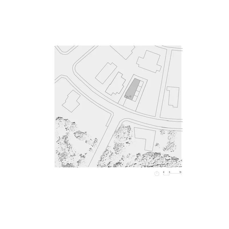 Site plan drawing showing the structure positioned among neighboring buildings and surrounding landscape