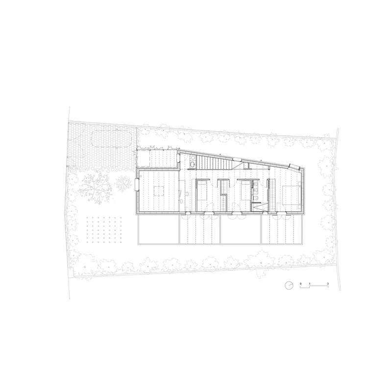 Upper floor plan drawing revealing bedroom spaces and the sloped roof structure above terrace