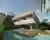 Venta Arquitetos Lifts a Brick Volume Over the Trees in Montes Claros