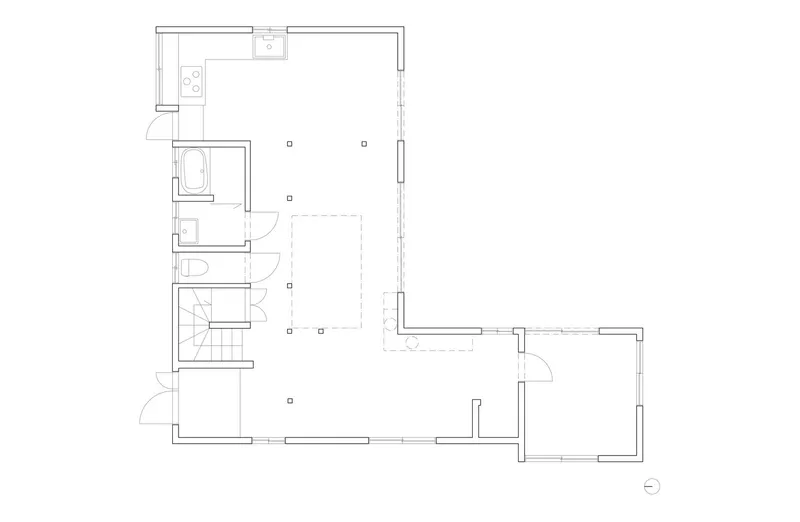 Floor plan drawing showing L-shaped layout with stair core and open living spaces