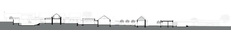 Section drawing displaying the pitched roof volumes and interior spatial relationships across the horizontal site