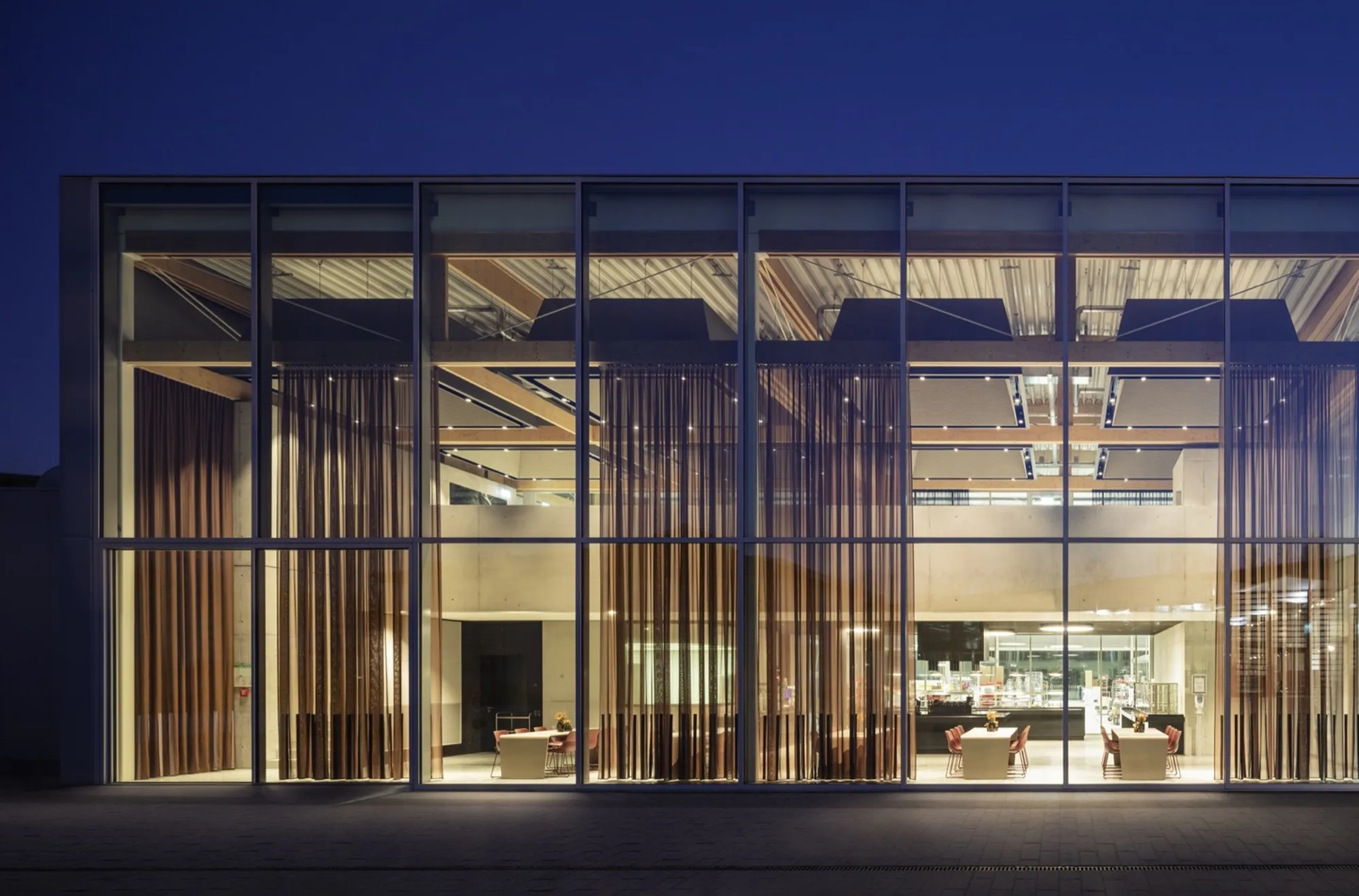 HENN Builds Brunner a Factory Where Office Workers and Production Lines Share One Timber Roof