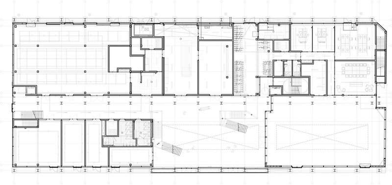 Floor plan drawing displaying a long rectangular layout with rooms along a central corridor