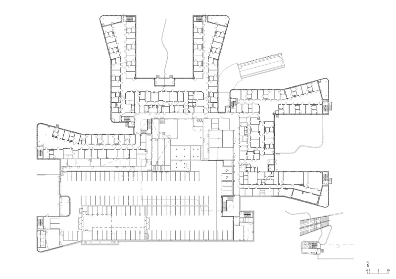 Floor plan drawing showing a pinwheel configuration of wings radiating from a central courtyard