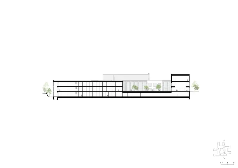 Section drawing depicting interior floors and a central glazed atrium with rooftop greenery
