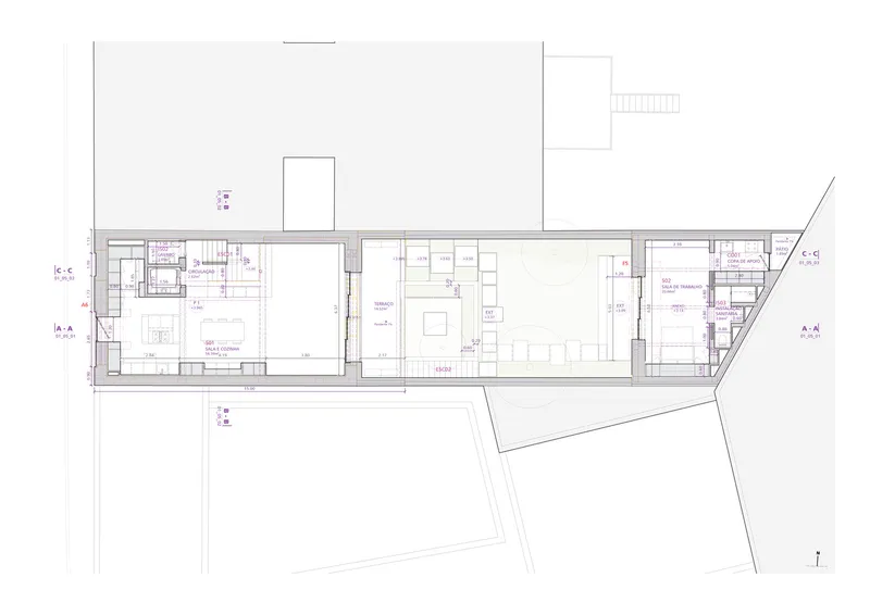 Floor plan drawing showing open living space, bedrooms, and angled site boundary