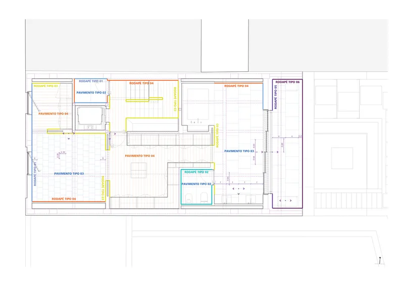 Floor plan drawing with color-coded room designations including a central staircase and divided living spaces
