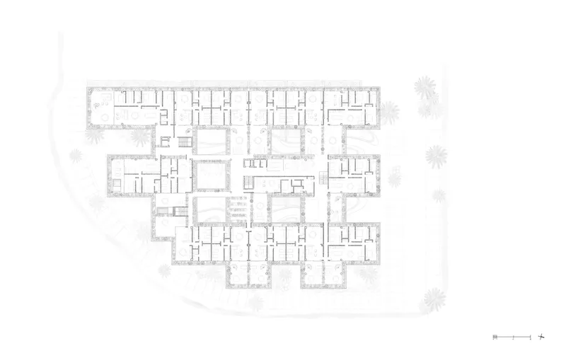 Upper floor plan drawing showing residential units arranged around central voids and landscaped courtyards