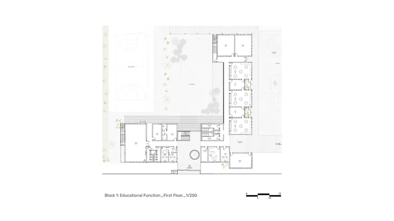 First floor plan of educational functions arranged in L-shaped wings with central circular void