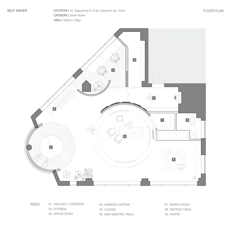 Floor plan drawing showing showroom with curved walls and circular lounge space