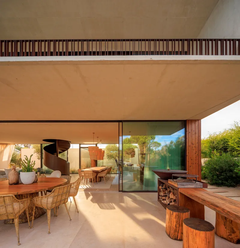 Covered terrace with timber soffit and slatted screen framing views to the interior