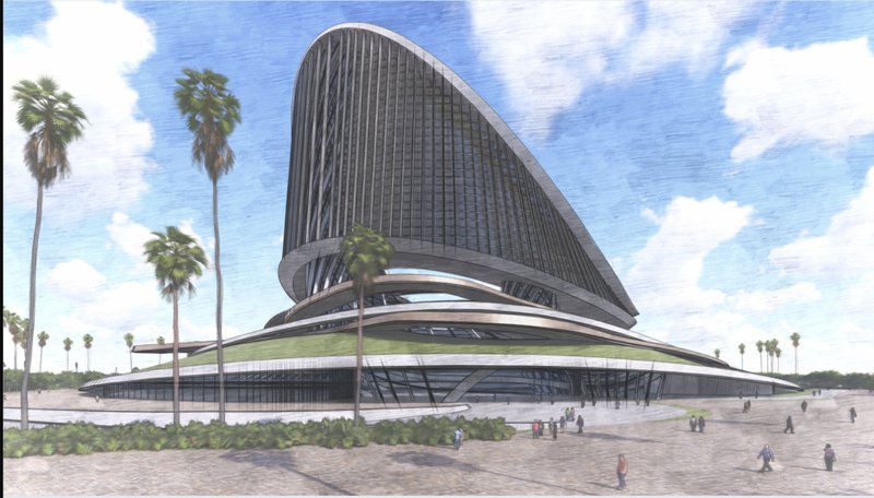 Land approach: the tower seen from a beach-side promenade with palms, pedestrians on the walkway, and the low recreational base stretching along the waterfront