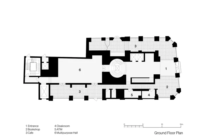 Ground floor plan drawing showing a multipurpose hall with a central spiral stair and adjacent entrance