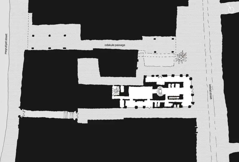 Site plan drawing showing the building footprint and surrounding urban context with adjacent streets