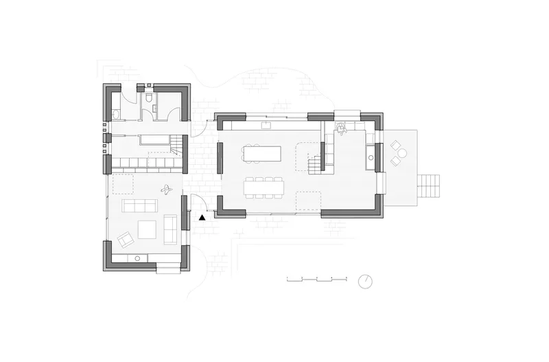 Ground floor plan with open living and dining areas connected by a central staircase