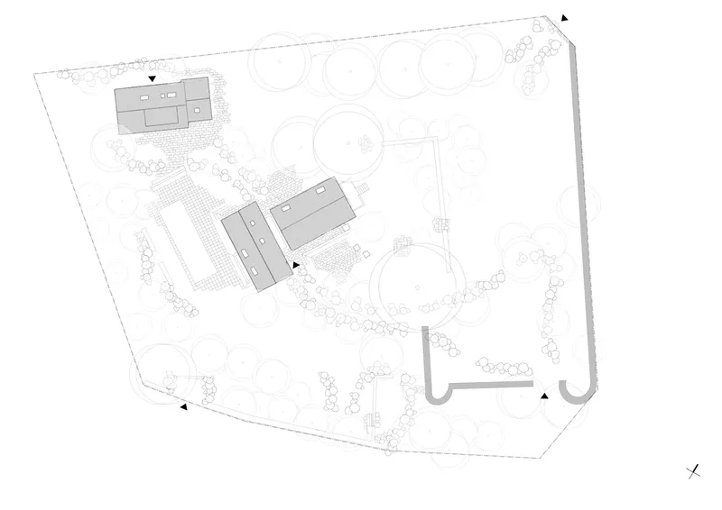 Site plan showing two buildings positioned among circular tree canopies and meandering paths