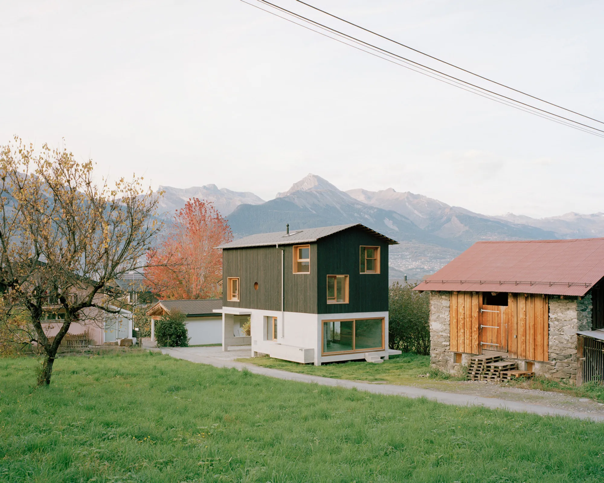 Lionel Ballmer Floats a Timber House Above a Swiss Orchard Like a Modern Raccard