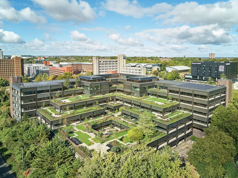 Aerial view of the stepped terraces with green roofs cascading down the central courtyard