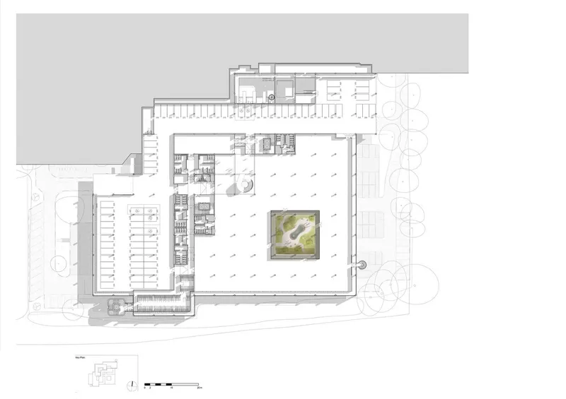 Ground floor plan drawing showing the building layout with central courtyard and surrounding circulation spaces