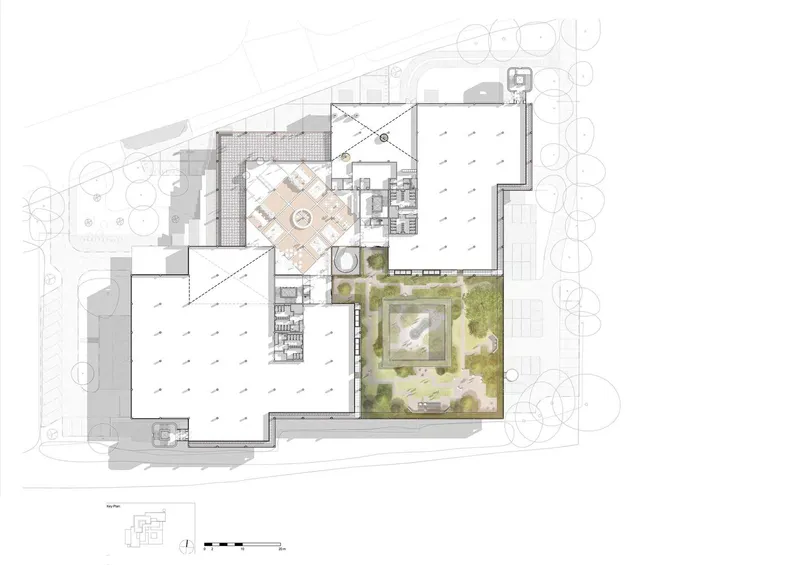 Upper floor plan drawing showing interior spaces with hatched paving area and landscaped courtyard