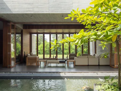 SYSTEM Architects and EKNC Build a Concrete Retreat Around Memory and Water in Bangladesh