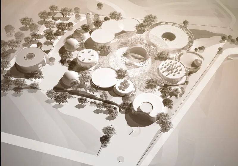 Site model showing circular and curved building volumes distributed among trees