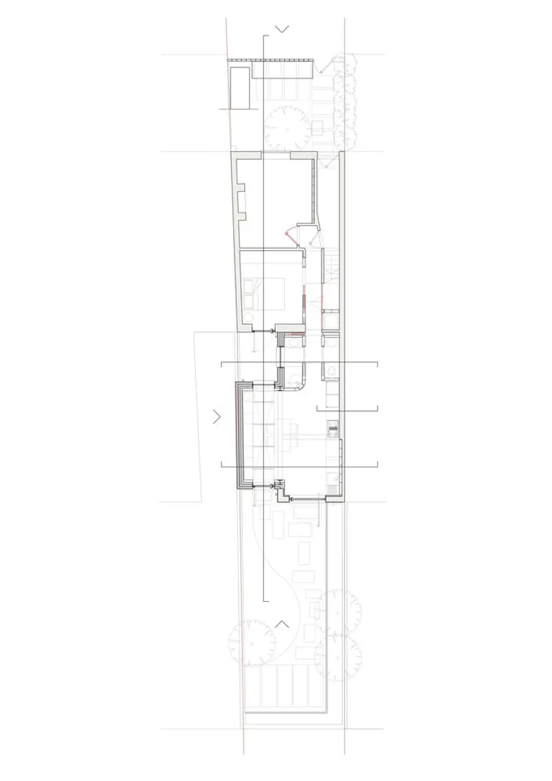Floor plan drawing showing narrow linear layout with series of rooms and courtyard spaces