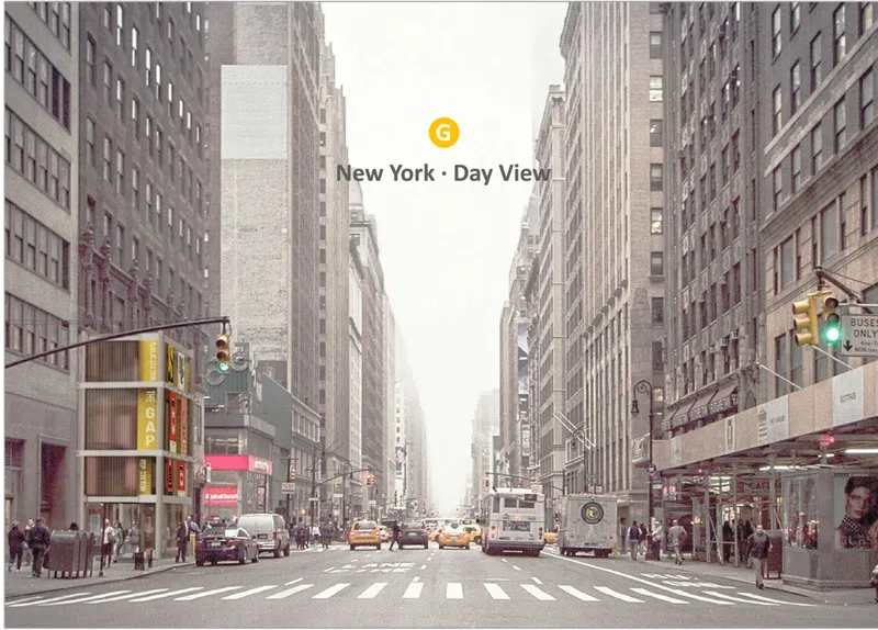 Avenue view between brick facades with traffic lights and yellow cabs under hazy daylight