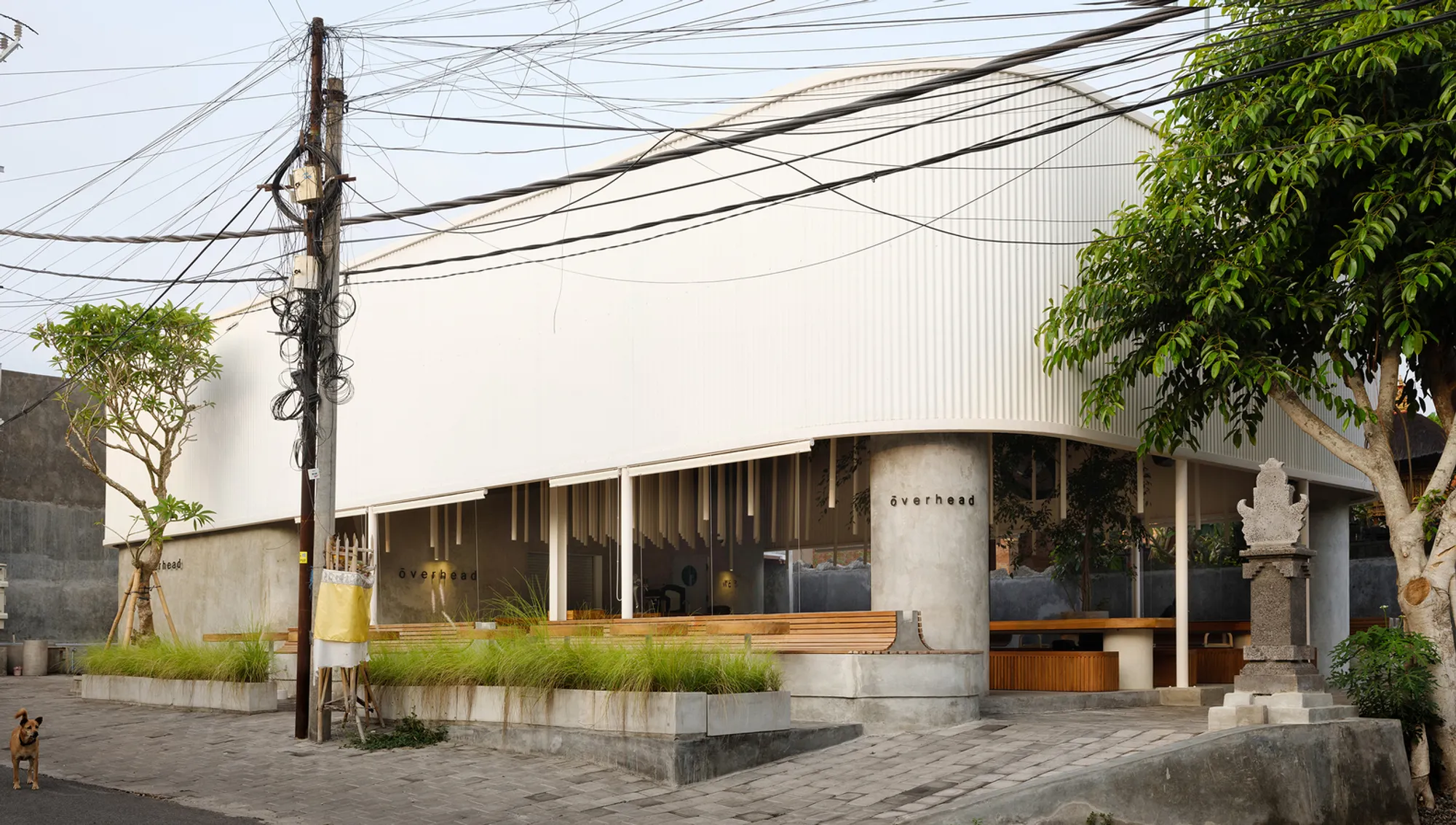 Max Tsybin and Greywoods.pro Slip a Minimalist Restaurant Beneath a Corrugated Canopy in Bali
