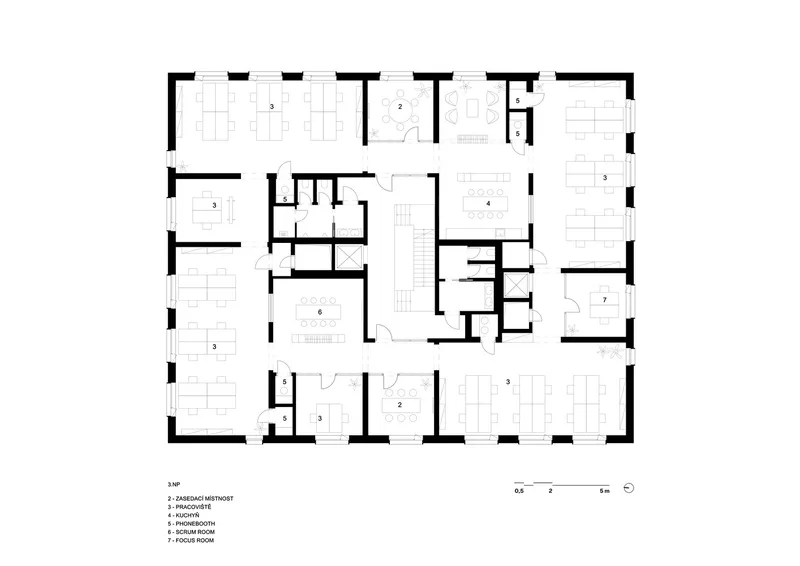 Floor plan drawing showing a central staircase surrounded by multiple office spaces and conference rooms