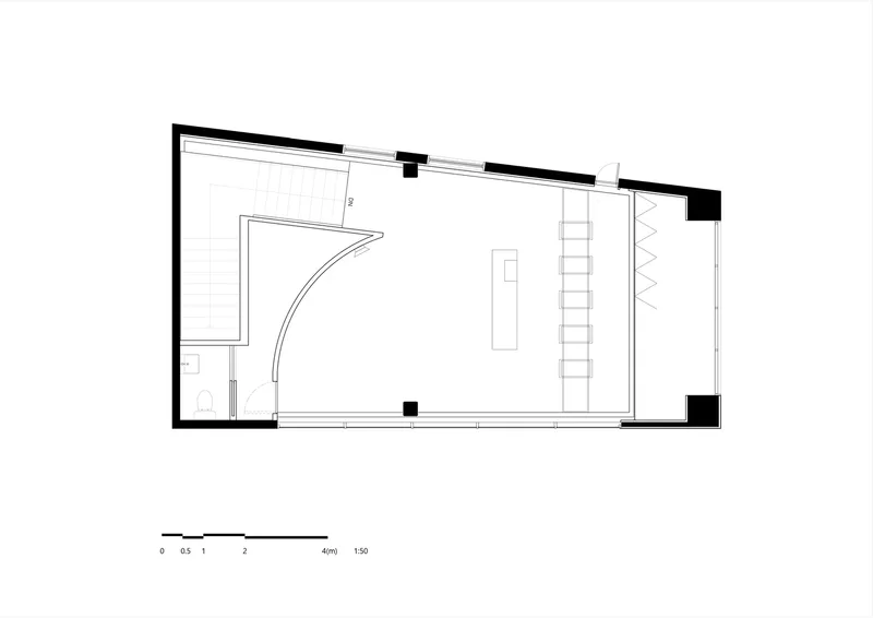 Floor plan drawing showing a curved interior wall, bathroom enclosure, ladder, and storage along one side