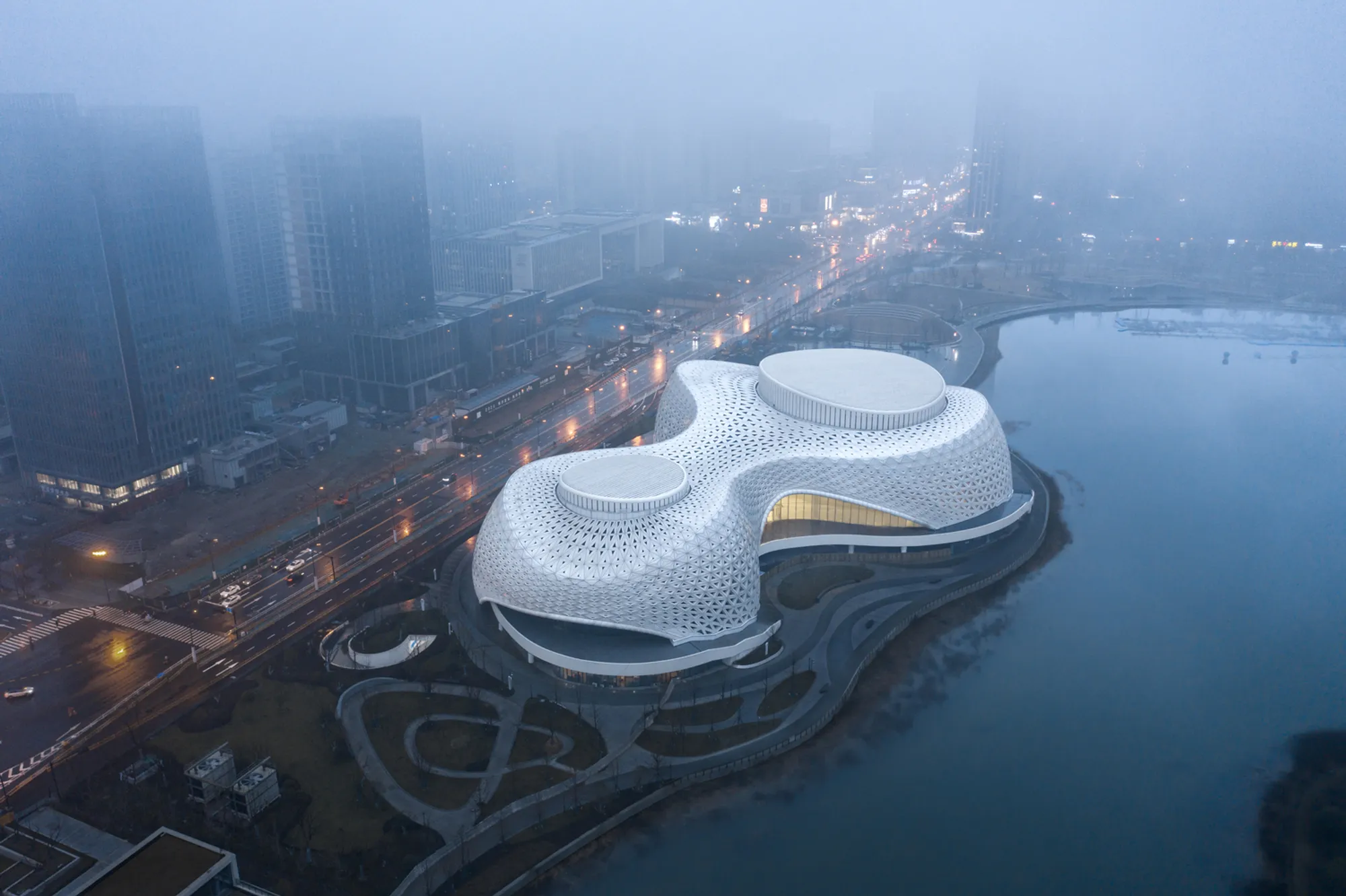 CCTN Design Wraps a 5,000-Triangle Skin Around a Lakefront Grand Theater in Hangzhou