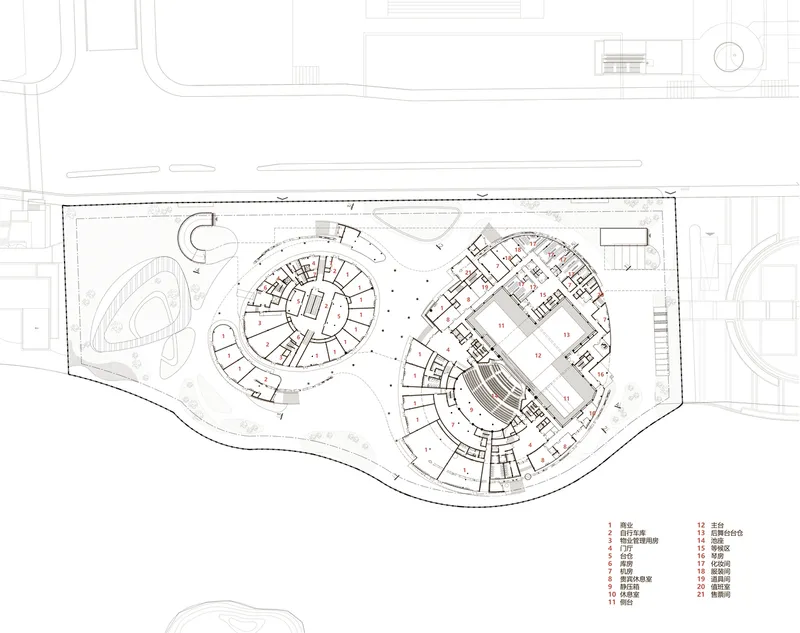 Floor plan drawing showing two circular volumes and one rectangular volume within an irregular perimeter
